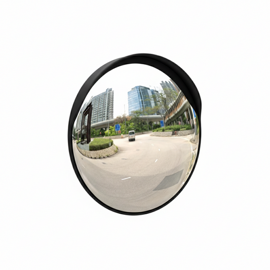 Convex mirror reflecting an urban street scene with buildings and a car.