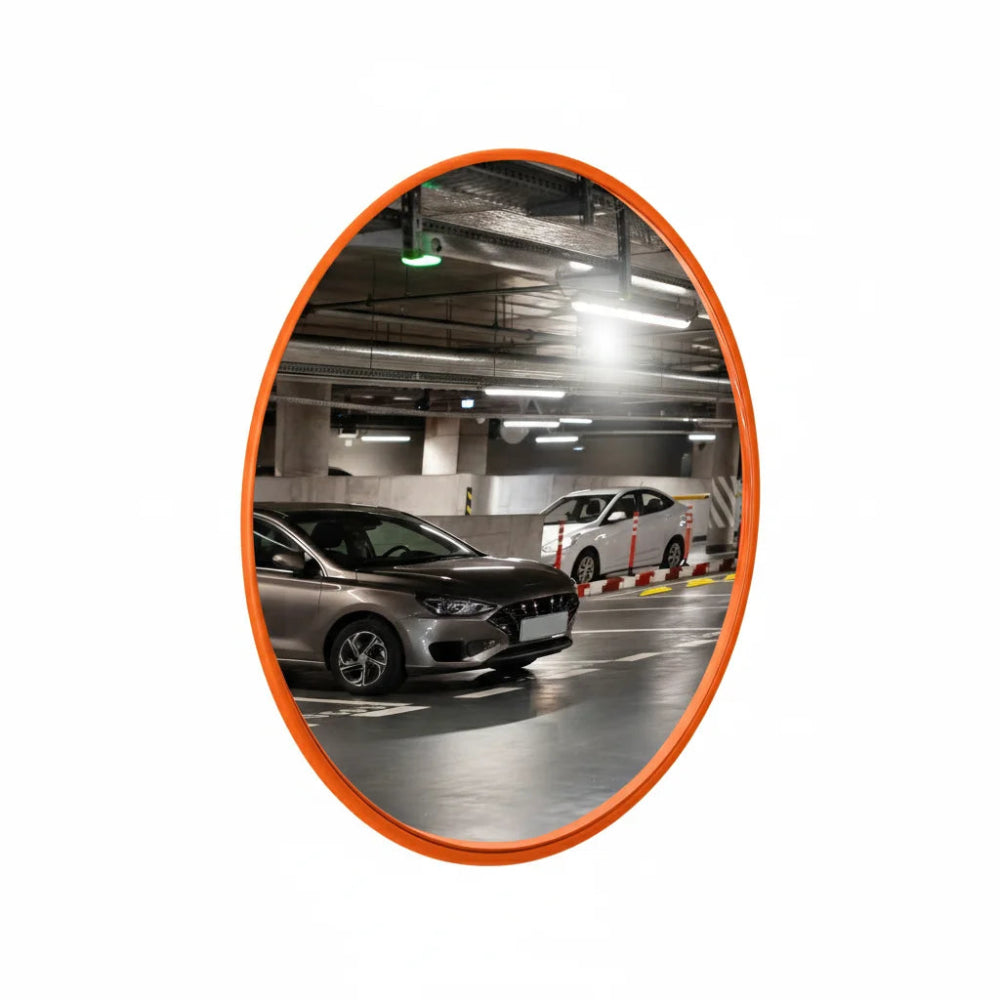 Convex mirror showing an underground parking area with cars.