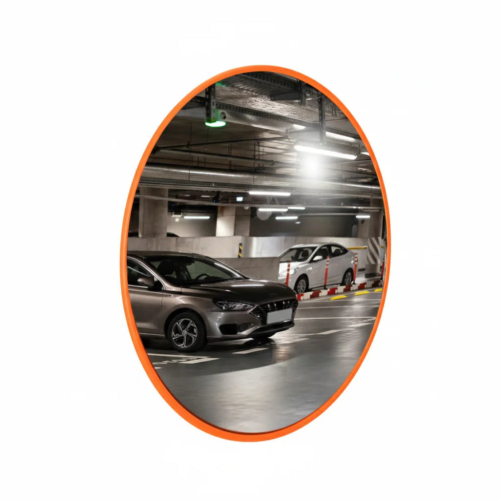 Convex mirror reflecting an underground parking area with cars.