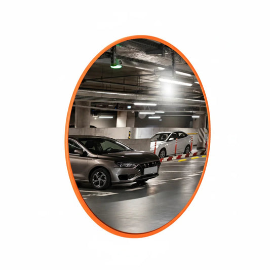 Convex mirror reflecting an underground parking area with cars.