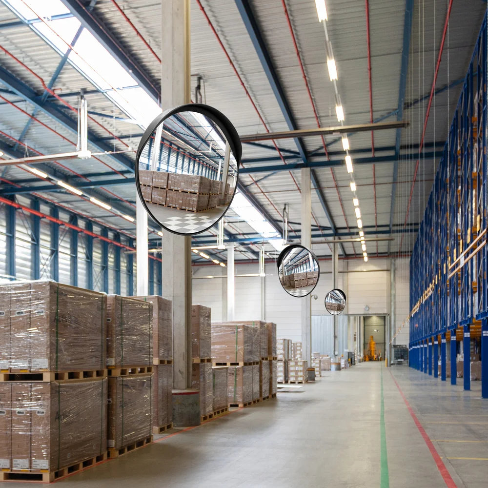 Large warehouse with stacked pallets and ceiling mirrors